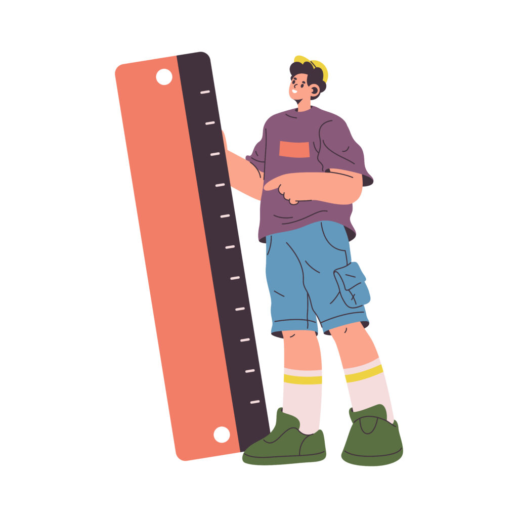 a man standing next to a ruler