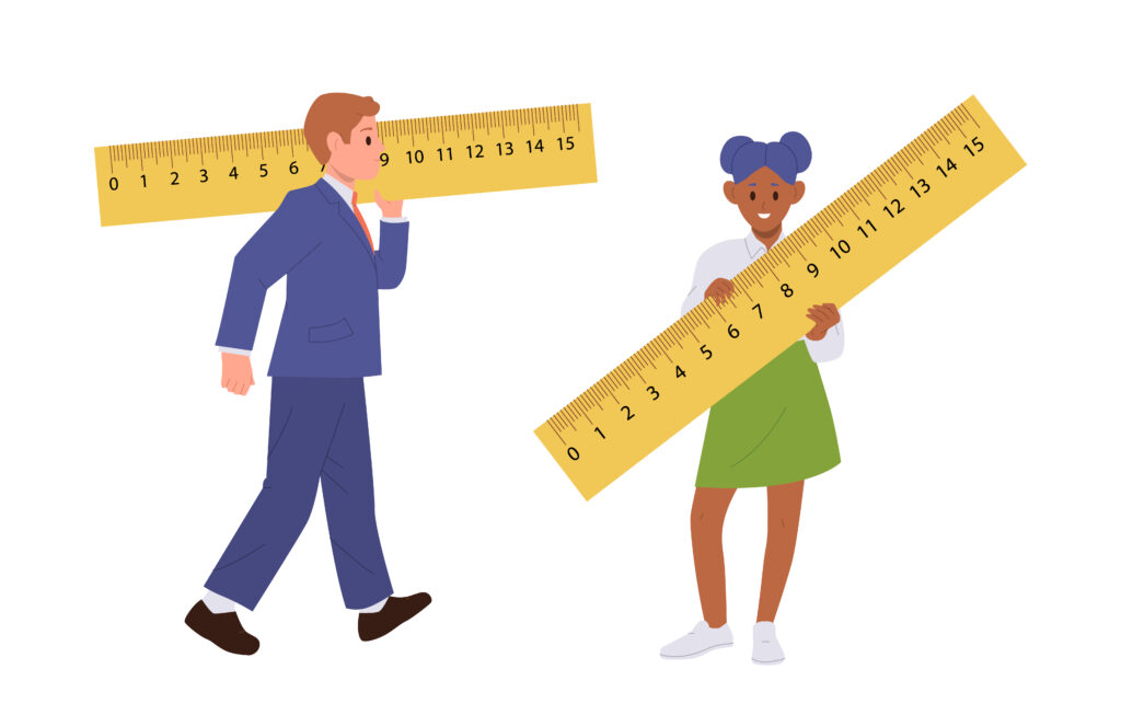 a man and woman holding large ruler